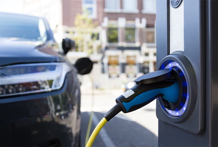 car at an electric charging station